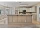 Kitchen showcasing neutral cabinets, granite countertops, stainless steel appliances, and adjacent breakfast area at 19 Thimblemill Ct, Villa Rica, GA 30180