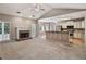 Open-concept living area flows into the kitchen, with a cozy fireplace and ample space for entertaining at 19 Thimblemill Ct, Villa Rica, GA 30180