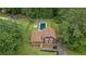 Aerial view of a home with a backyard pool, surrounded by lush greenery and mature trees at 35 Lady Morgan Ln, Dallas, GA 30157