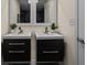 Stylish bathroom featuring double floating vanities with dark wood cabinets and modern fixtures at 35 Lady Morgan Ln, Dallas, GA 30157