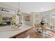 Well-lit dining area adjacent to a kitchen with white marble countertops and modern appliances at 35 Lady Morgan Ln, Dallas, GA 30157