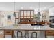 Modern kitchen island with bar seating, white countertops, and stainless steel appliances at 35 Lady Morgan Ln, Dallas, GA 30157
