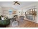 Bright and open living room connected to the kitchen, featuring hardwood floors and modern decor at 35 Lady Morgan Ln, Dallas, GA 30157