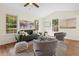 Comfortable living room with large windows, a cozy sofa, and elegant decorative accents at 35 Lady Morgan Ln, Dallas, GA 30157