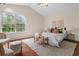 Bright and airy main bedroom with vaulted ceilings, large windows, and comfortable furnishings at 35 Lady Morgan Ln, Dallas, GA 30157
