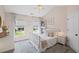 Comfortable bedroom with vaulted ceilings, natural light, and neutral tones at 121 Bradshaw Park Dr, Woodstock, GA 30188