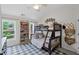 bedroom with built in bunkbeds, bookshelves, ceiling fan, and a light, airy atmosphere at 121 Bradshaw Park Dr, Woodstock, GA 30188