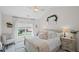 Charming bedroom with vaulted ceilings, a cozy bed, and ample natural light at 121 Bradshaw Park Dr, Woodstock, GA 30188