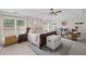 Spacious primary bedroom with vaulted ceilings, large windows, and a cozy sitting area at 121 Bradshaw Park Dr, Woodstock, GA 30188