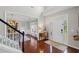Elegant foyer showcasing hardwood floors, a staircase, and a decorative front door with sidelights that provide natural light at 121 Bradshaw Park Dr, Woodstock, GA 30188