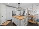 Bright kitchen featuring a central island, stainless steel appliances, and an adjacent eating area at 121 Bradshaw Park Dr, Woodstock, GA 30188