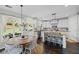 Spacious kitchen with stainless steel appliances, a kitchen island, and an adjacent dining space at 121 Bradshaw Park Dr, Woodstock, GA 30188