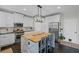 Modern kitchen featuring a central island, stainless steel appliances, and white cabinetry at 121 Bradshaw Park Dr, Woodstock, GA 30188
