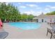 A pristine community pool with lounge chairs provides a refreshing and relaxing outdoor amenity at 121 Bradshaw Park Dr, Woodstock, GA 30188