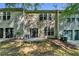 Townhome backyard showing patio with sliding glass doors to the home's interior at 2008 Hailston Dr, Duluth, GA 30097