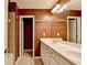A bathroom with double vanity with a large mirror and white cabinets, plus an adjoined toilet area and shower at 2008 Hailston Dr, Duluth, GA 30097