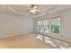 Bedroom with large windows and a tray ceiling at 2008 Hailston Dr, Duluth, GA 30097