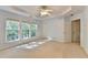 A bright bedroom has lots of natural light from the three large windows with neutral colored carpet at 2008 Hailston Dr, Duluth, GA 30097