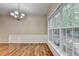 Dining area filled with natural light from large windows and hardwood floors at 2008 Hailston Dr, Duluth, GA 30097