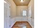 Inviting entryway with paneled walls and wood flooring at 2008 Hailston Dr, Duluth, GA 30097