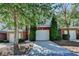 Townhouse exterior with an attached garage and mature landscaping at 2008 Hailston Dr, Duluth, GA 30097