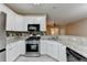Close-up of kitchen with stainless steel appliances and mosaic backsplash at 2008 Hailston Dr, Duluth, GA 30097
