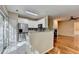 View of open concept kitchen with stainless steel appliances and breakfast bar at 2008 Hailston Dr, Duluth, GA 30097
