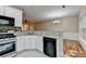 Charming kitchen with stone countertops, tile backsplash, and stainless steel appliances at 2008 Hailston Dr, Duluth, GA 30097