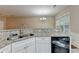 Well-lit kitchen features a stainless steel sink, granite countertops, and white cabinetry at 2008 Hailston Dr, Duluth, GA 30097