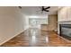 Open-concept living area with a fireplace, hardwood floors, and plenty of natural light at 2008 Hailston Dr, Duluth, GA 30097
