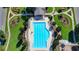 Birds-eye view of community pool area with chairs, landscaping, and nearby clubhouse at 2008 Hailston Dr, Duluth, GA 30097