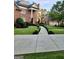 Elegant brick home with landscaped grounds and a circular driveway at 6205 Arnall Nw Ct, Acworth, GA 30101