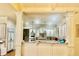 Open concept kitchen features stainless steel appliances and bright custom white cabinetry at 6205 Arnall Nw Ct, Acworth, GA 30101