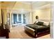 Expansive main bedroom with sitting area, luxury bed and textured accent wall at 6205 Arnall Nw Ct, Acworth, GA 30101