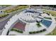 Bird's eye view of a community park featuring a plaza, water feature, amphitheater and landscaping at 1002 Harvest Park Ln, Suwanee, GA 30024