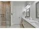 Spacious bathroom with a tiled shower, glass door, and double sink vanity at 1002 Harvest Park Ln, Suwanee, GA 30024