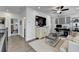 Neutral bonus room features hardwood floors, television, cabinets, and a desk perfect for working from home at 1002 Harvest Park Ln, Suwanee, GA 30024
