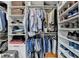 Organized closet space with shelves, hanging rods, and designated shoe storage at 1002 Harvest Park Ln, Suwanee, GA 30024