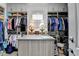 Well-organized walk-in closet with custom shelving, drawers, and ample storage space at 1002 Harvest Park Ln, Suwanee, GA 30024