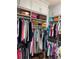 Organized closet featuring ample hanging space and shelving for clothes, shoes, and accessories at 1002 Harvest Park Ln, Suwanee, GA 30024