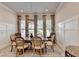 Elegant dining room with seating for six, a stylish chandelier and natural light at 1002 Harvest Park Ln, Suwanee, GA 30024