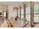 Bright dining area featuring modern lighting, decor, and large windows at 1002 Harvest Park Ln, Suwanee, GA 30024