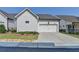 Charming single-Gathering home with a two-car garage and well-maintained landscaping, located in a desirable neighborhood at 1002 Harvest Park Ln, Suwanee, GA 30024