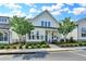 Charming two-story home featuring a welcoming front porch and manicured landscaping at 1002 Harvest Park Ln, Suwanee, GA 30024