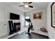 Home gym with television, workout equipment and natural light creates an ideal space for fitness at 1002 Harvest Park Ln, Suwanee, GA 30024