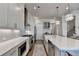 Modern kitchen boasts custom cabinets, subway tile backsplash, and state-of-the-art appliances at 1002 Harvest Park Ln, Suwanee, GA 30024