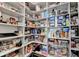 Walk-in pantry offers ample shelving for organized storage at 1002 Harvest Park Ln, Suwanee, GA 30024