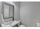 Powder room features a stylish vanity and fixtures at 1002 Harvest Park Ln, Suwanee, GA 30024