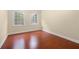 Bright bedroom features beautiful hardwood floors and two windows at 2355 Henderson Mill Ne Rd # 6, Atlanta, GA 30345
