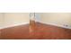 Cozy living room showcasing beautiful hardwood floors, a doorway to other rooms and neutral colored walls at 2355 Henderson Mill Ne Rd # 6, Atlanta, GA 30345
